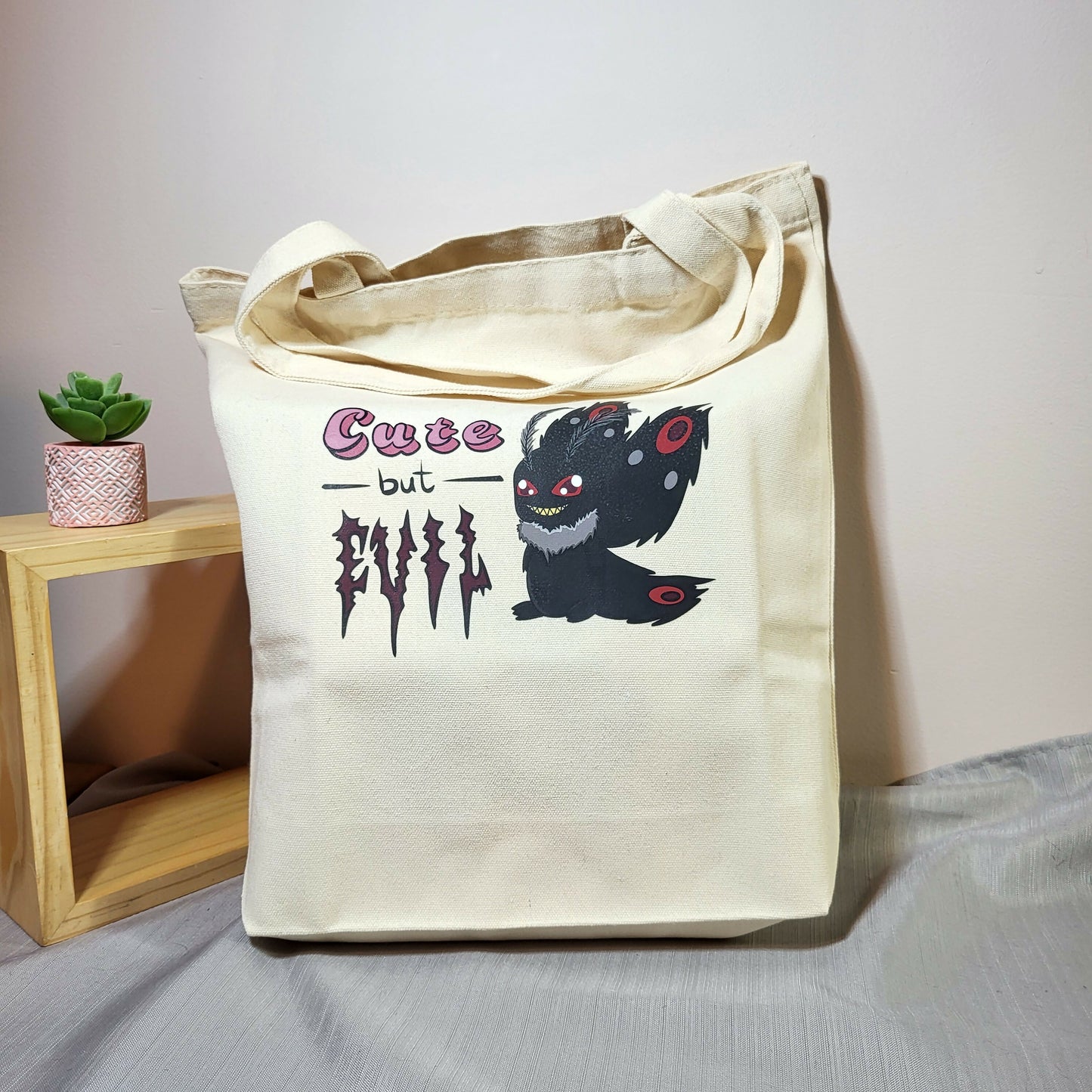 Cute but Evil mothman tote bag